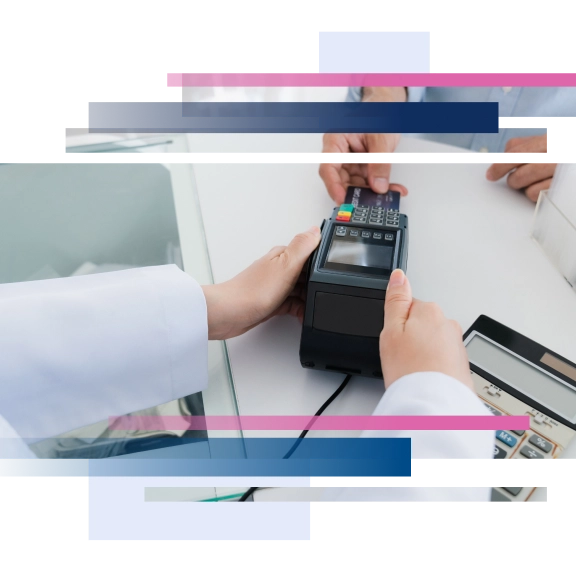 Hands using a card reader for a transaction on a glass counter