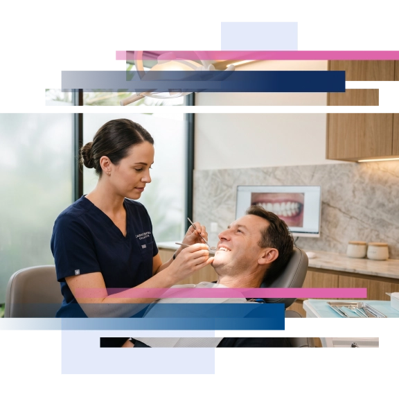Dental professional examining a patient's teeth in a modern clinic setting.