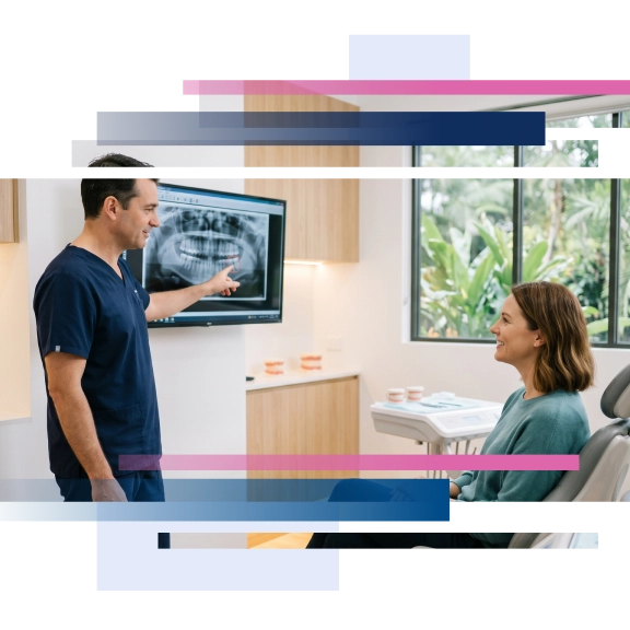 Dentist showing X-ray image to a patient in a dental office setting.